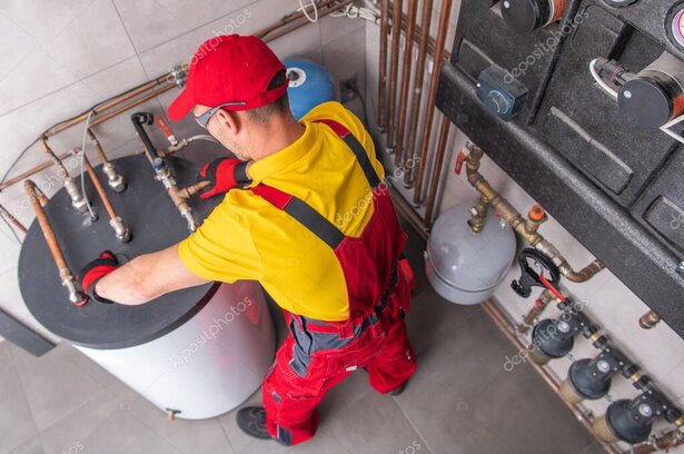 Plumber inspecting a residential water heater
