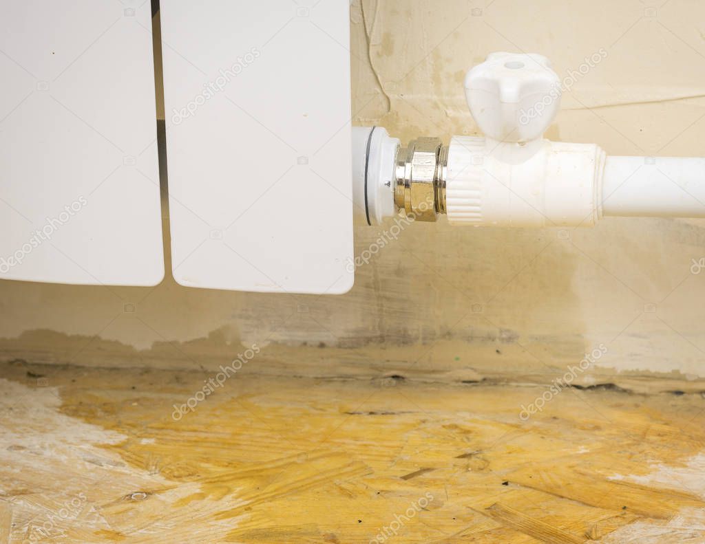 Emergency plumber responding to a burst pipe