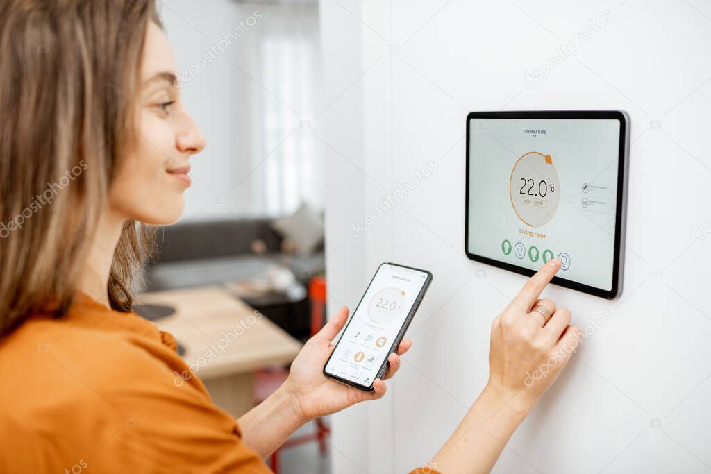 Close-up of a smart thermostat on a wall