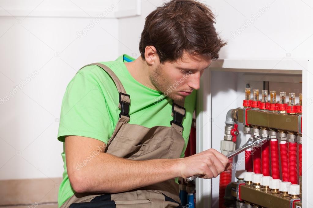 Plumber working on residential piping