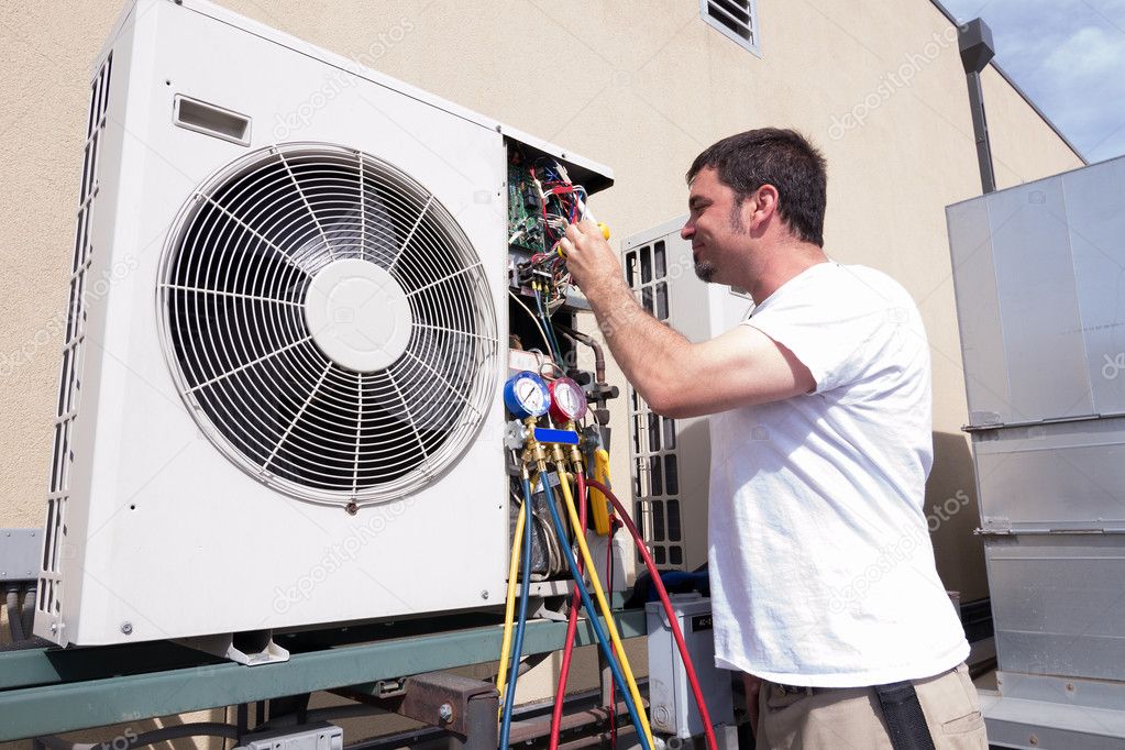 HVAC lead servicing an outdoor condenser