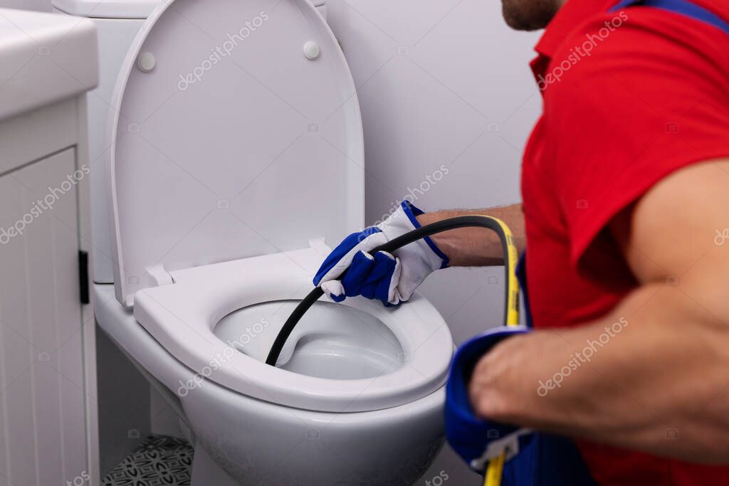 Hydro‑jetting hose cleaning a sewer pipe