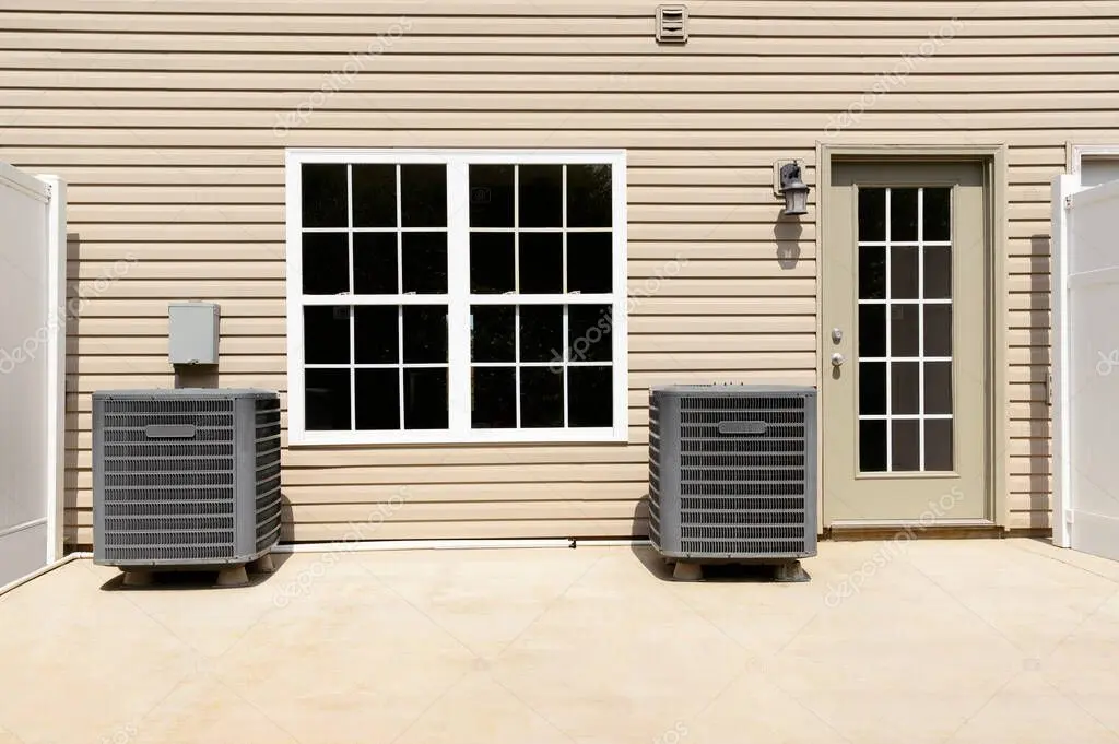 Air conditioning unit outside a suburban home