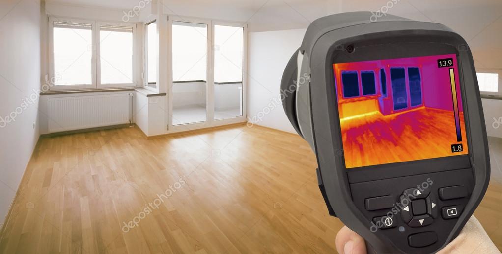 Technician using thermal camera for leak detection